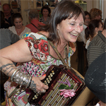 Minelle playing the accordion